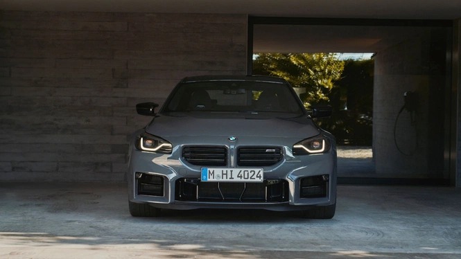 BMW m2 with silver wheels front in grey paint