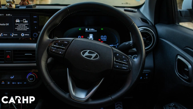 White 2023 Hyundai Exter Ownership Review Steering Wheel & Dashboard Interior Photograph